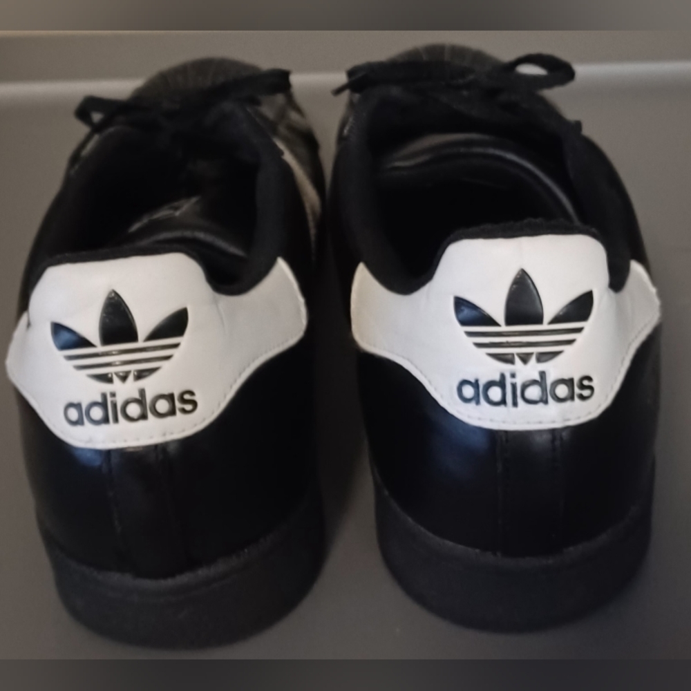 Adidas Men's size 16 old school shell toe shoes black with white stripes.
